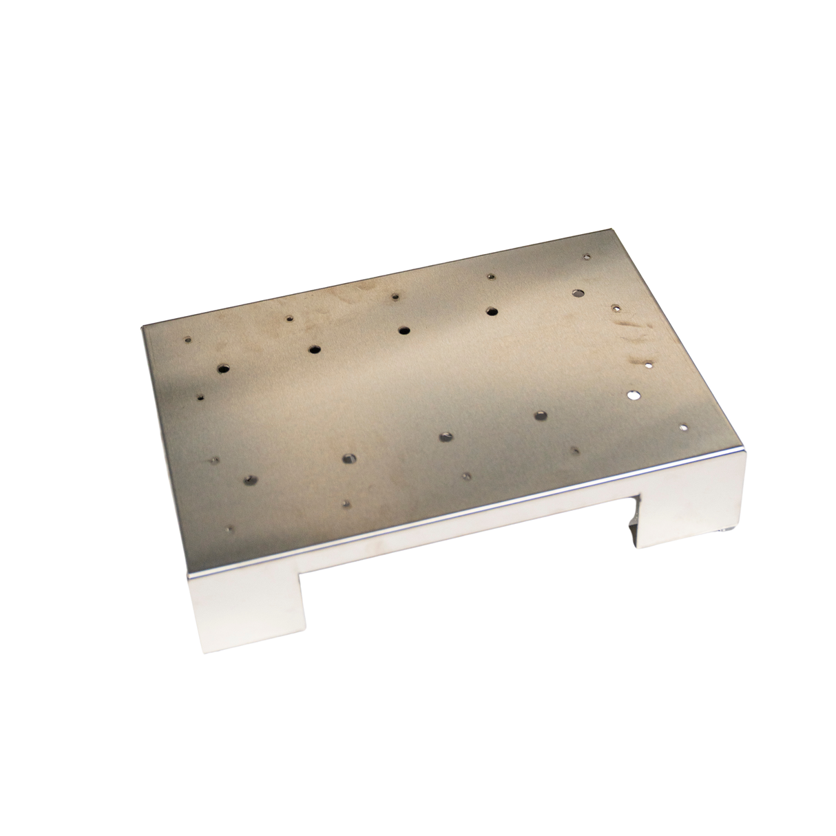 Metal platform with multiple holes on a white background