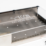 Metallic device with 'EGON' branding on a white background